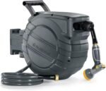 The retractable garden hose providing efficient watering for plants with brass connectors.